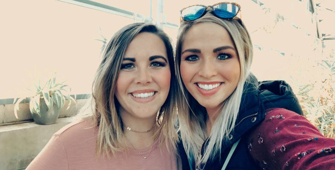 Two sisters  smiling business owners